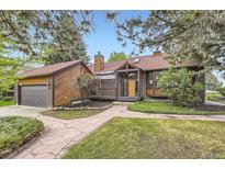 Charming front exterior showcasing a unique brick design and welcoming stone pathway at 916 W Alder St, Louisville, CO 80027