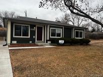 Charming single-story home with tidy front yard and mature trees at 6392 S Hill St, Littleton, CO 80120