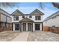 Modern duplex with white siding, black trim, green accents, and inviting curb appeal at 2430 Ames St, Edgewater, CO 80214