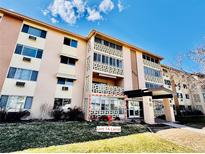 Exterior view of the condo building with well-maintained landscaping and inviting entrance at 605 S Alton Way # 7A, Denver, CO 80247