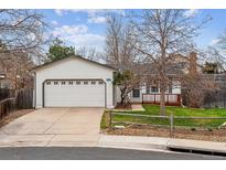 Charming single-Gathering home with a two car garage, a cozy porch, and curb appeal at 1492 S Cathay St, Aurora, CO 80017