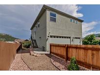 Modern home with a two-car garage and low maintenance landscaping, perfect for easy living at 265 Upper Glenway, Palmer Lake, CO 80133