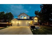 Charming two-story home with a three car garage and well-manicured lawn at 4892 S Robb St, Littleton, CO 80127