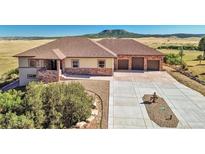 Stunning ranch home with 3-car garage and mountain views at 5585 Country Club Dr, Larkspur, CO 80118