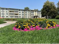 Attractive apartment building with well-manicured landscaping at 9335 E Center Ave # 8B, Denver, CO 80247