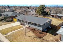 Charming single-story home featuring a well-maintained front yard and a detached garage at 3461 S Ivy Way, Denver, CO 80222