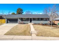 Charming single-story home with a well-maintained front yard and driveway at 3461 S Ivy Way, Denver, CO 80222