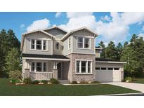 Charming two-story home featuring a stone facade, welcoming porch, and attached two-car garage at 8609 Yellowcress St, Littleton, CO 80125