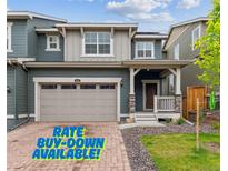 Charming two-story home with a two-car garage and a welcoming front porch at 645 Flintwood Pl, Lafayette, CO 80026