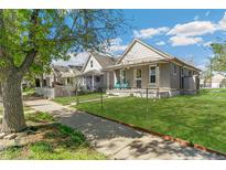 Charming single-Gathering home with a well-manicured lawn and inviting curb appeal at 4353 Sherman St, Denver, CO 80216