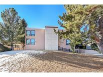 Mid-century modern building exterior, featuring a clean design and landscaping at 13682 W Virginia Dr, Lakewood, CO 80228