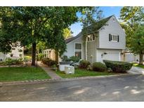 Inviting gray two-story home with charming landscaping and a well-maintained front yard at 4505 S Yosemite St # 125, Denver, CO 80237