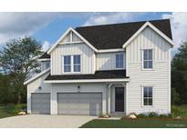Charming two-story home showcasing board and batten siding, a gabled roof, and an attached two-car garage at 938 Coal Bank Trl, Castle Rock, CO 80104