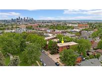 Stunning aerial view of a building complex and Denver skyline, showcasing the vibrant city and location at 3050 W 32Nd Ave # 202C, Denver, CO 80211