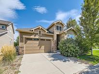 Charming two-story home showcasing a well-manicured lawn, a neutral palette, and a two-car garage at 16658 Prospect Ln, Broomfield, CO 80023