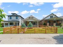 Charming home featuring a well-maintained front yard and classic architectural details at 3320 N Columbine St, Denver, CO 80205