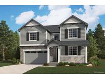 Charming two-story home with stone accents, gray siding, white trim, and a welcoming covered front porch at 25214 E Warren Pl, Aurora, CO 80018