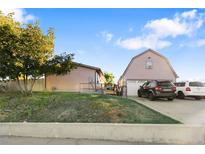 Ranch style home with attached garage and large yard at 360 Linda Ln, Denver, CO 80221