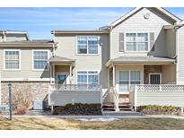 Charming townhouse featuring a stone accent, neutral siding, and well-maintained landscaping at 209 W Jamison Cir # 32, Littleton, CO 80120