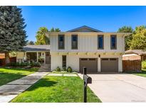 Two-story home with updated exterior and landscaping at 3951 S Narcissus Way, Denver, CO 80237