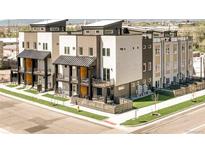 Modern townhomes boast sleek designs, balconies, and a landscaped corner lot at 2105 S Galapago St # 4, Denver, CO 80223