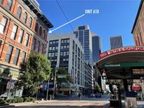 Building exterior with a view of RTD 16th & California station on a sunny day at 1555 California St # 610, Denver, CO 80202