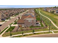 Beautiful two-story home featuring a well-manicured yard and solar panels in a Gathering-friendly neighborhood at 848 Sandstone Cir, Erie, CO 80516