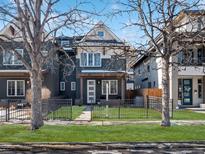 Charming two-story home with a well-manicured front yard and a classic craftsman style at 4571 Stuart St, Denver, CO 80212