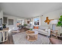 Bright and airy living room featuring a modern decor with an open floor plan at 3738 Miller Ct, Wheat Ridge, CO 80033