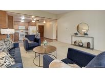 Cozy living room features stylish furniture and an open floor plan to the kitchen at 625 S Alton Way # 10D, Denver, CO 80247