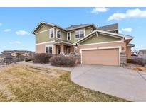 Charming home featuring a two-car garage, landscaped front yard, and inviting exterior at 3672 S Perth Cir # 101, Aurora, CO 80013