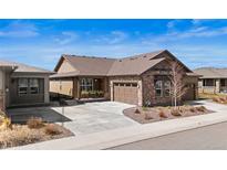 Charming single-story home with stone accents, well-maintained landscaping, and inviting curb appeal at 4475 Hidden Gulch Rd, Castle Rock, CO 80104