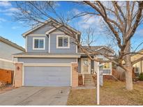 Charming two-story home with a brick-accented garage and landscaped front yard at 12527 Tammywood St, Broomfield, CO 80020