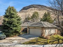 Charming single Gathering house with well maintained lawn and 2-car garage at 837 Meadow Run, Golden, CO 80403