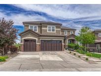 Beautiful two-story home featuring a large three-car garage, landscaped yard, and a traditional design at 27625 E Moraine Dr, Aurora, CO 80016