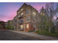 Multi-story condominium with well-maintained landscaping and exterior balconies at 5677 S Park Pl # D310, Greenwood Village, CO 80111
