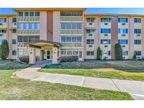 Well-maintained condo building with mature landscaping and updated entryway at 710 S Alton Way # 5A, Denver, CO 80247