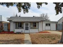 Cozy ranch home with a well-maintained front yard at 1256 Ulster St, Denver, CO 80220