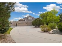 Beautiful single-Gathering home with attached three-car garage and large concrete driveway and extra storage shed at 10044 E 146Th Pl, Brighton, CO 80602