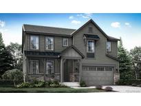 Beautiful two-story home featuring gray siding and a covered front porch at 7438 S Yank Ct, Littleton, CO 80127
