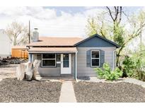 Charming bungalow with gray siding, a quaint front porch, and a well-maintained landscape at 4209 S Bannock St, Englewood, CO 80110