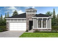 Charming single-Gathering home featuring a two-car garage, stone accents, and lush green lawn at 2011 Grayside Cir, Castle Rock, CO 80109