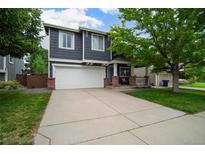 Charming two-story home with a two-car garage and covered front porch at 517 Sylvestor Trl, Highlands Ranch, CO 80129