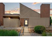Charming townhouse featuring a unique architecture, a well-maintained walkway and some beautiful landscaping at 3300 W Florida Ave # 36, Denver, CO 80219