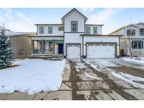 Charming two-story home with a three-car garage and inviting front porch at 339 Rocking Chair Dr, Berthoud, CO 80513