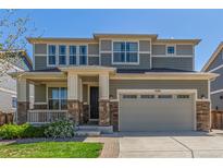 Beautiful two-story home with a well-manicured lawn and a charming front porch at 1226 S Fulton St, Aurora, CO 80247