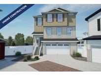 Charming two-story home featuring a two-car garage and landscaped front yard under construction at 22033 E 38Th Pl, Aurora, CO 80019