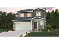 Charming two-story home featuring a manicured lawn, attached two-car garage, and inviting front porch at 2221 Flower Blossom Ave, Brighton, CO 80601