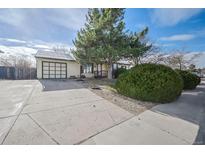 Ranch-style home with a spacious yard and attached garage at 2804 W 100Th Ave, Denver, CO 80260