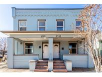 Charming two-story home with a shared front porch and light blue exterior at 2707 N Lafayette St, Denver, CO 80205